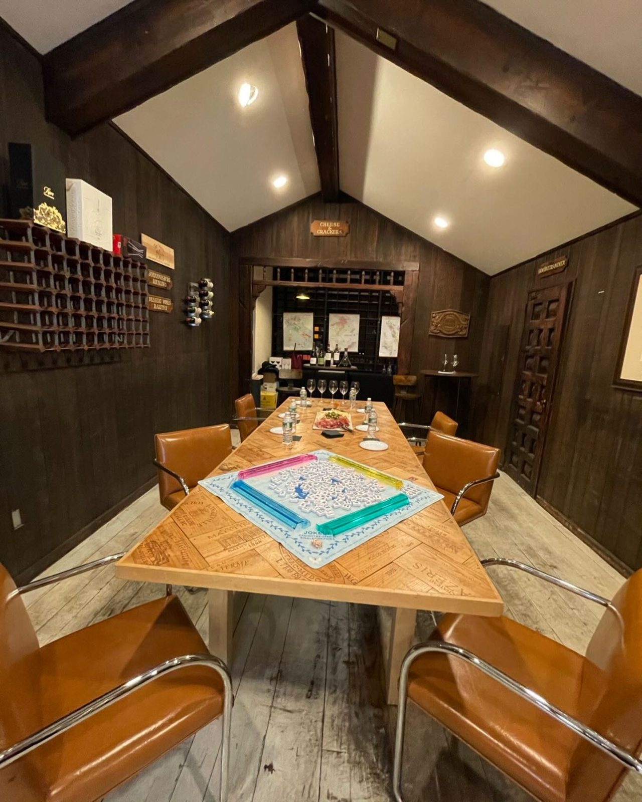 The private tasting room with its long wine-crate table and leather chairs